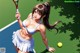 A woman in a bikini holding a tennis racket on a tennis court.